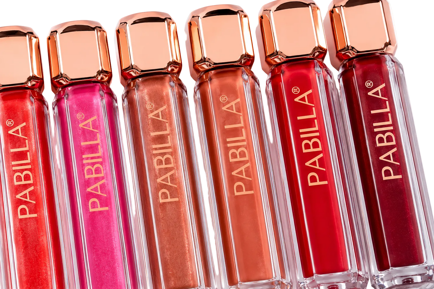 Six Pabilla liquid lipstick tubes in shimmering shades of red, pink, bronze, peach, coral, and deep berry, arranged side-by-side on a white background.