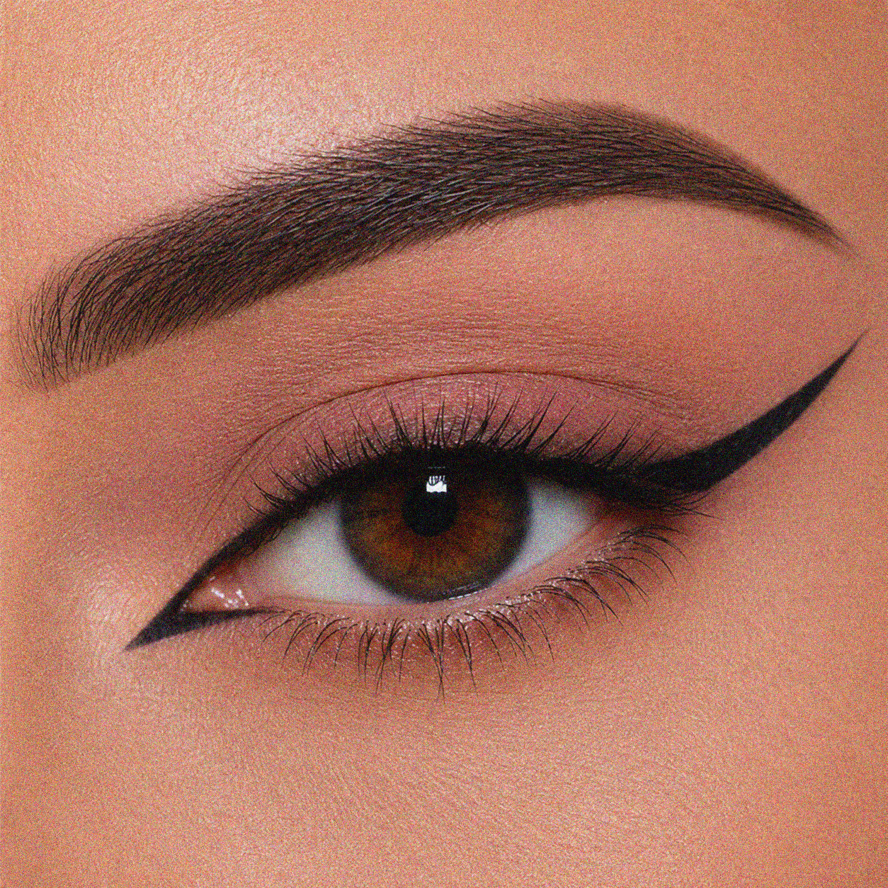 Eye with precise winged eyeliner line applied using Pabilla Line Perfect eyeliner